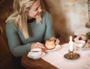 Woman enjoying cinnamon buns and coffee